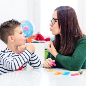 speech therapist working with child