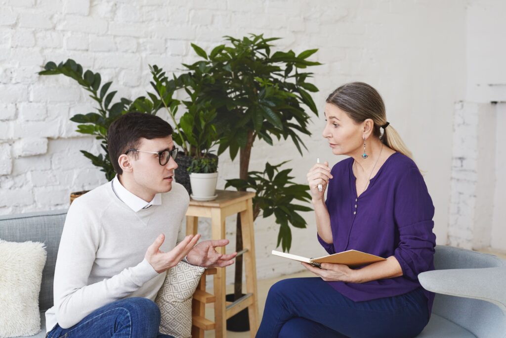 A woman giving speech therapy for an adult
