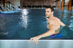 Man using a hydrotherapy pool at a Melbourne centre for muscle recovery and rehabilitation