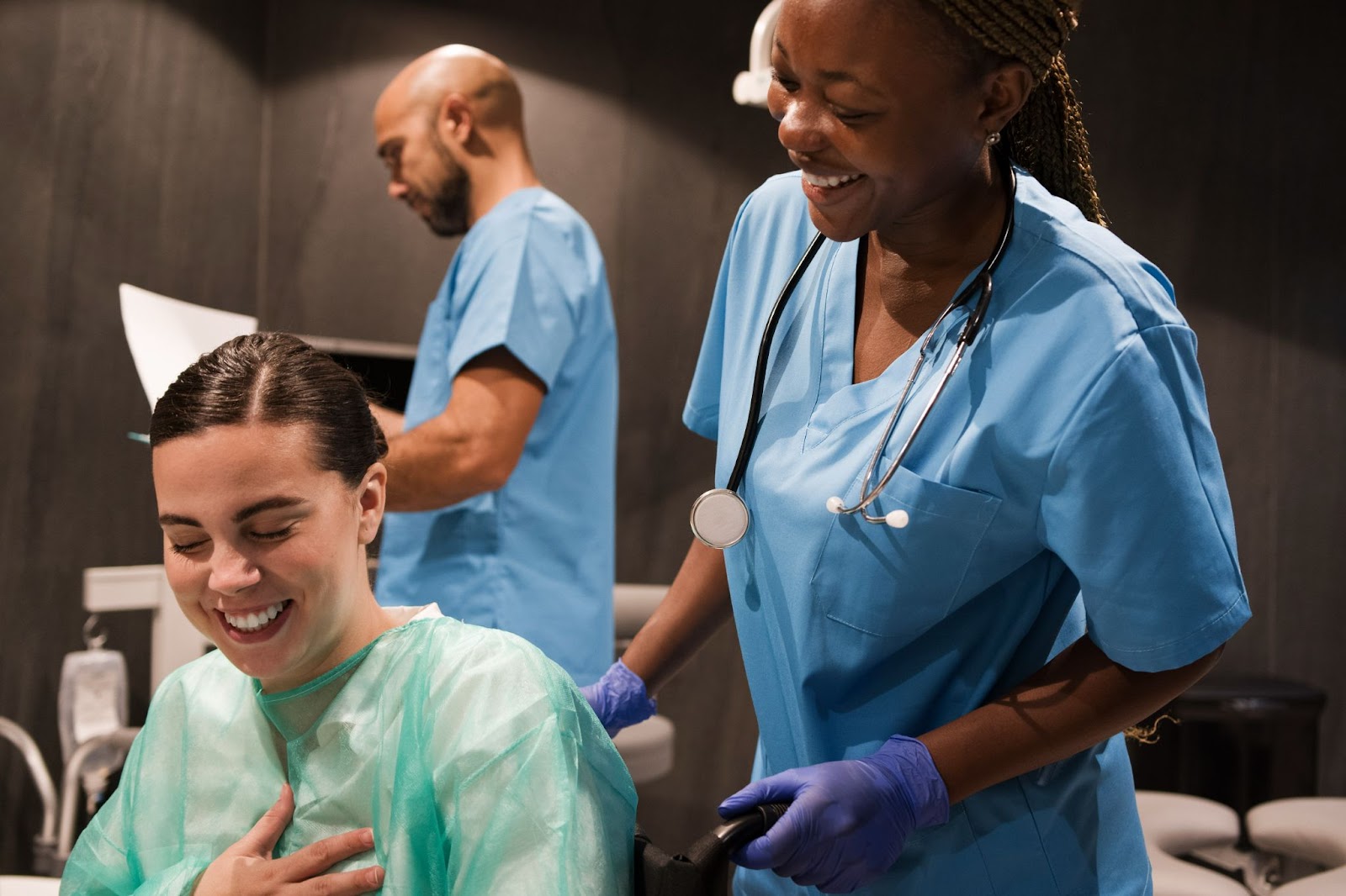 Smiling physiotherapist helping a patient with post surgery rehabilitation activities at an on-premise rehabilitation centre